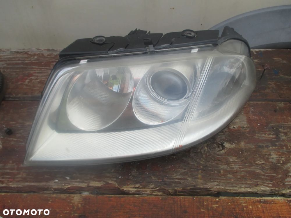 lampa lewa VW Passat B5 LIFT Hella Europa - 1