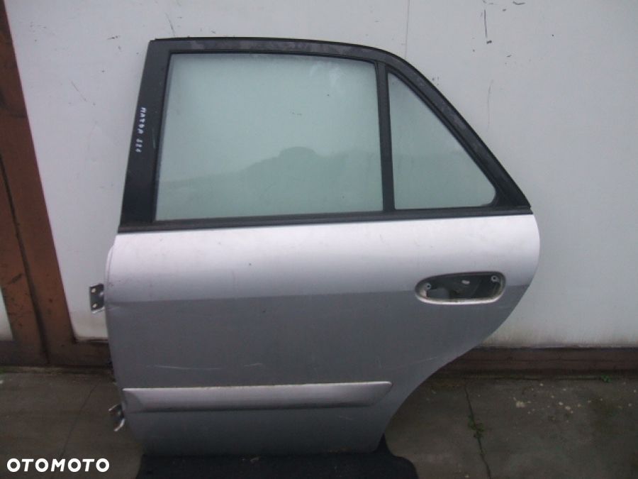 MAZDA 626 97-02 DRZWI lewe tył ZAWIAS SZYBA - 2
