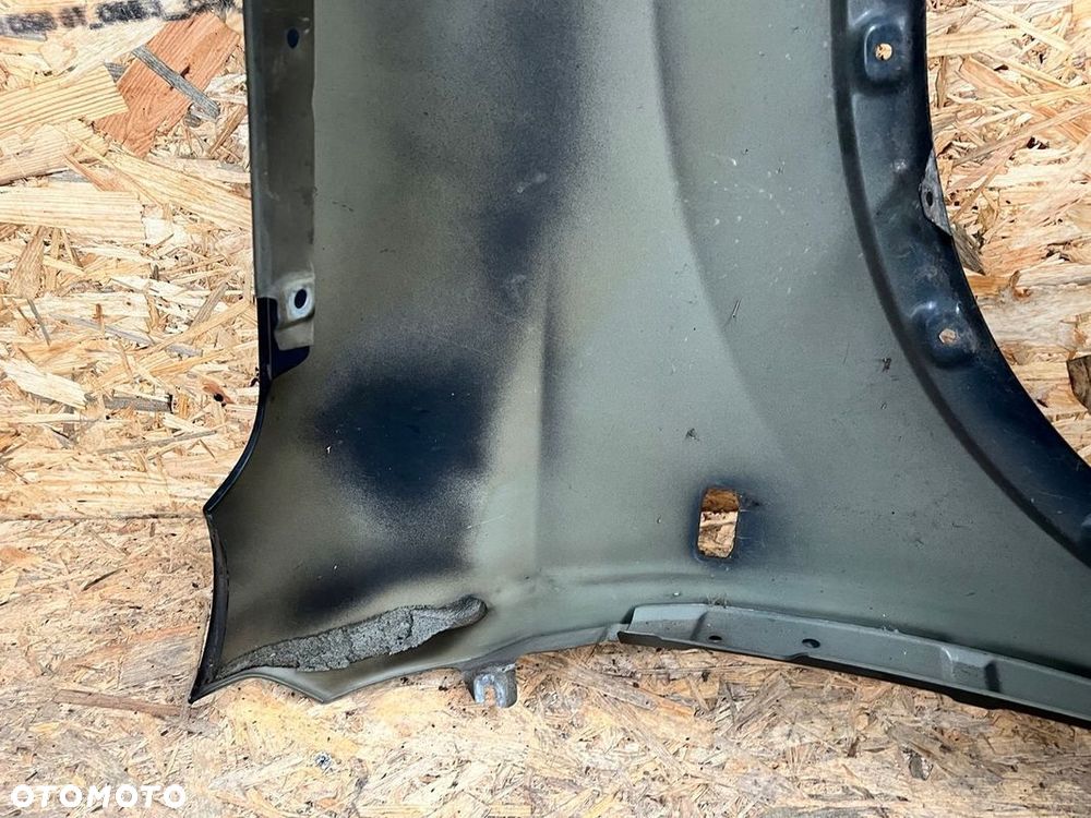 BŁOTNIK LEWY NISSAN QASHQAI J10 Kod lakieru: Z11 - 12