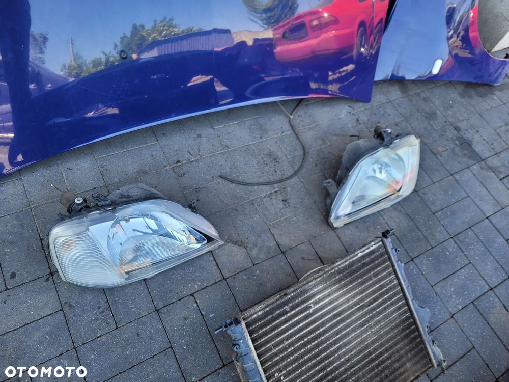 Dacia Logan I 04-08 1.4 Zestaw maska lampy blotniki chlodnica zderzak - 7