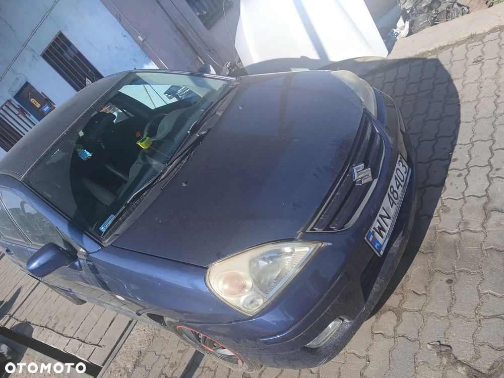 suzuki liana zdu maska zderzak lampa grill błotnik drzwi zbiornik paliwa szyba lusterko klamka - 1