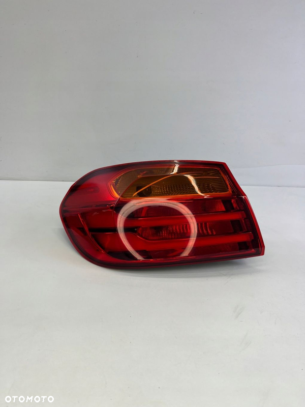 LAMPA LEWY TYŁ W BŁOTNIK BMW F32 F36 PRZED LIFTEM 7296097