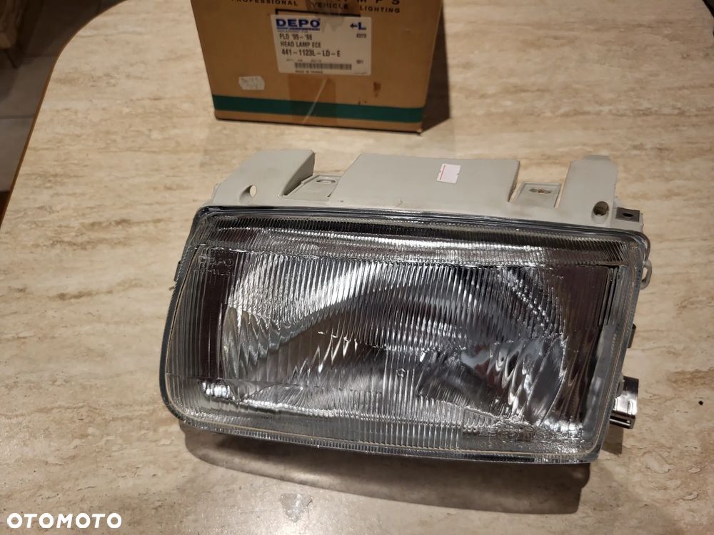 Reflektor Lewy  H4, manualny, bez silnika, kolor wkładu: srebrny VW POLO III 6N1 10.94-10.99 - 1