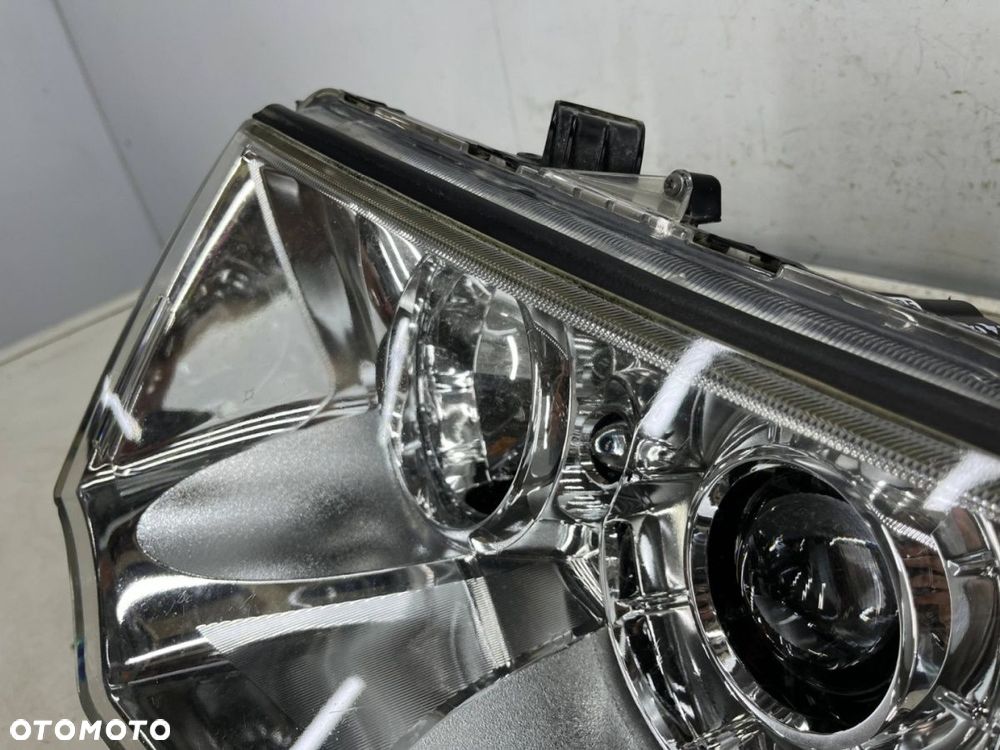 Lampa reflektor Mitsubishi L200 LIFT 10-15r. Pajero Sport II 03-16r. LEWA przednia soczewka EUROPA - 14