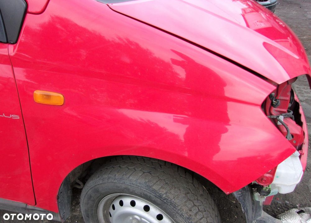 DAIHATSU CUORE VI 03-07R BŁOTNIK PRZÓD PRAWY - 1