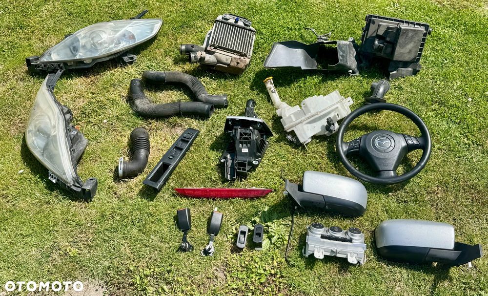 Mazda 5 CR 2005/2007 i 2008/2010r zderzak przedni tylny maska błotnik wzmocnienie belka chłodnice stan b.dobry Europa zwykle i xenon ksenon gołe i kompletne !!! Posiadam również zbiorniczki spryskiwaczy  spryskiwacze lamp  halogeny kratki  Grill i dużo innych Czesci do mazdy 5 CR !!! - 24