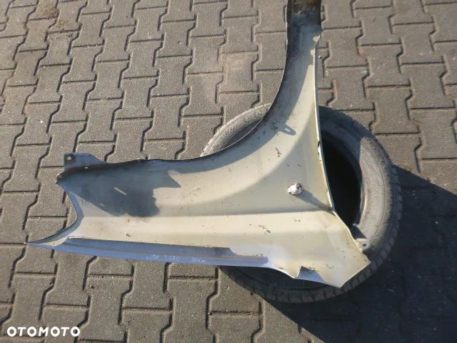 BŁOTNIK LEWY PRZÓD LEWY PRZEDNI CHEVROLET AVEO II T250 07-11 - 12