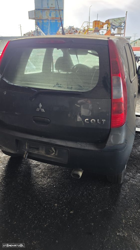 Mala para-choques e Farolins Mitsubishi Colt C30 - 1