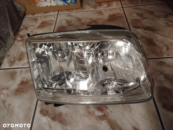 Reflektor Prawy  (H1/H7, elektryczny, bez silnika VW POLO III 6N2 10.99-09.01