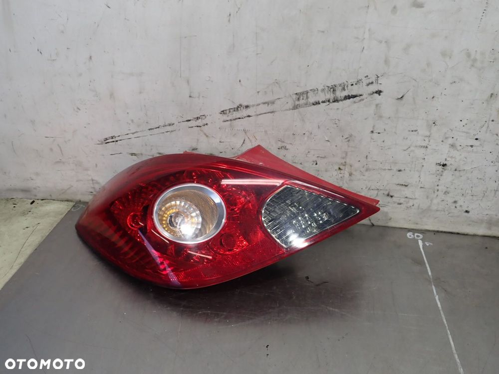 LAMPA LEWA TYLNA OPEL CORSA D 1.3CDTI 13211840 - 1