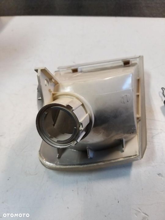 Lampa kierunkowskaz migacz  PRZÓD LEWY FORD ESCORT V/VI, ORION III 07.90-01.95 (biały) - 2