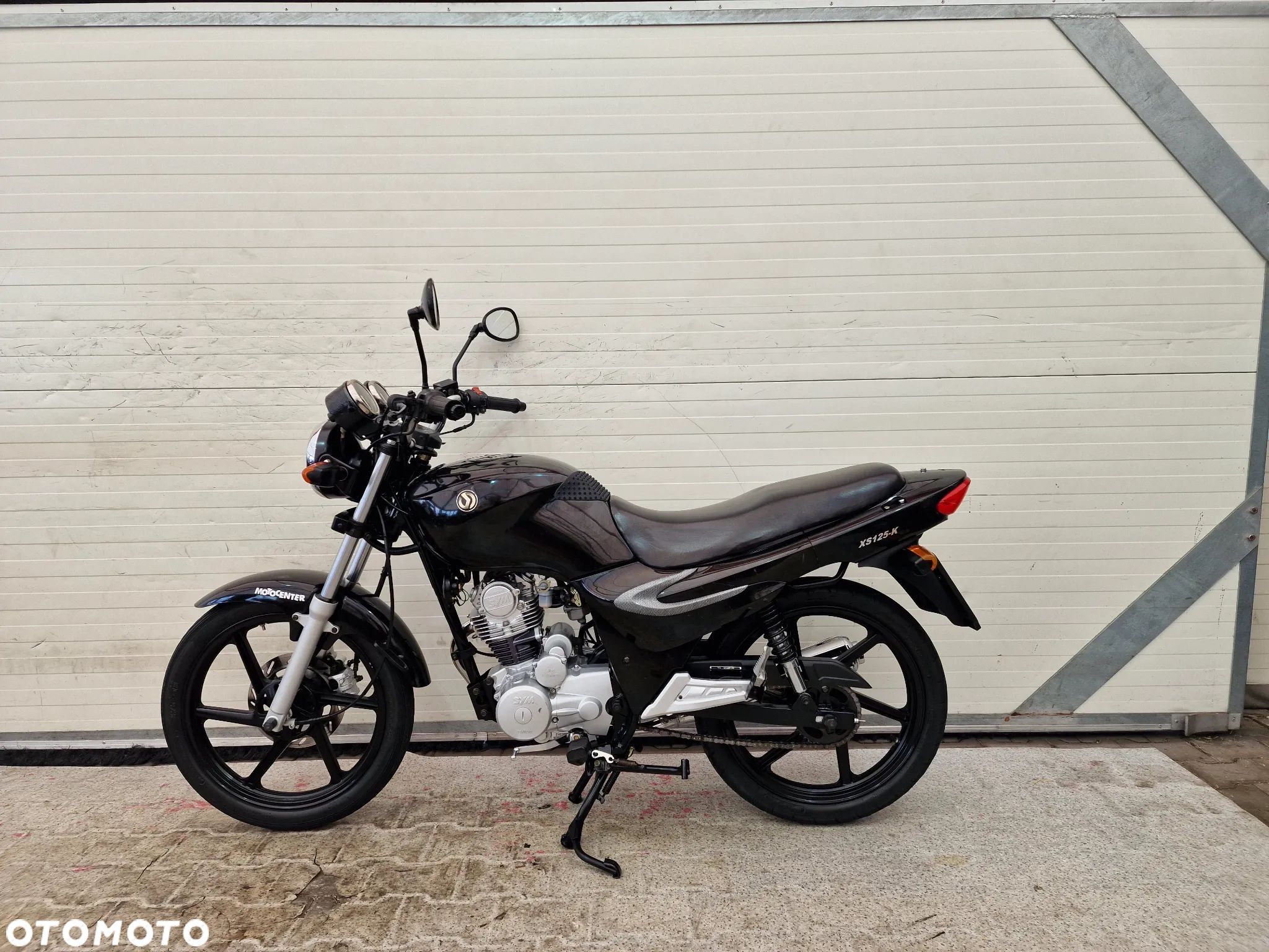 SYM XS - 1