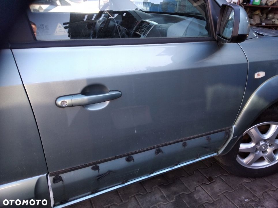 Hyundai Tucson drzwi przod przednie prawe BU - 1
