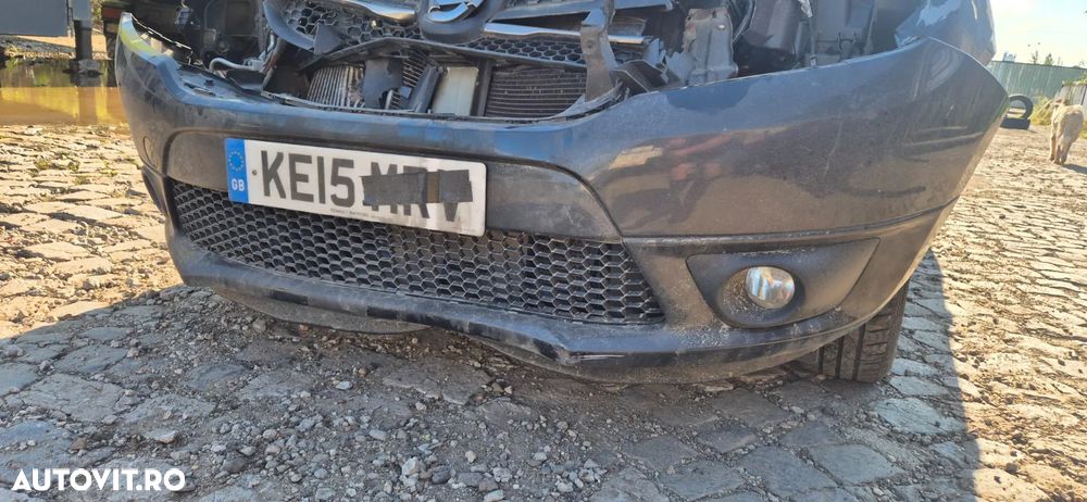 Bara spoiler fata cu proiectoare / are defect / lipseste partea de sus Dacia Logan MCV 2 - 2