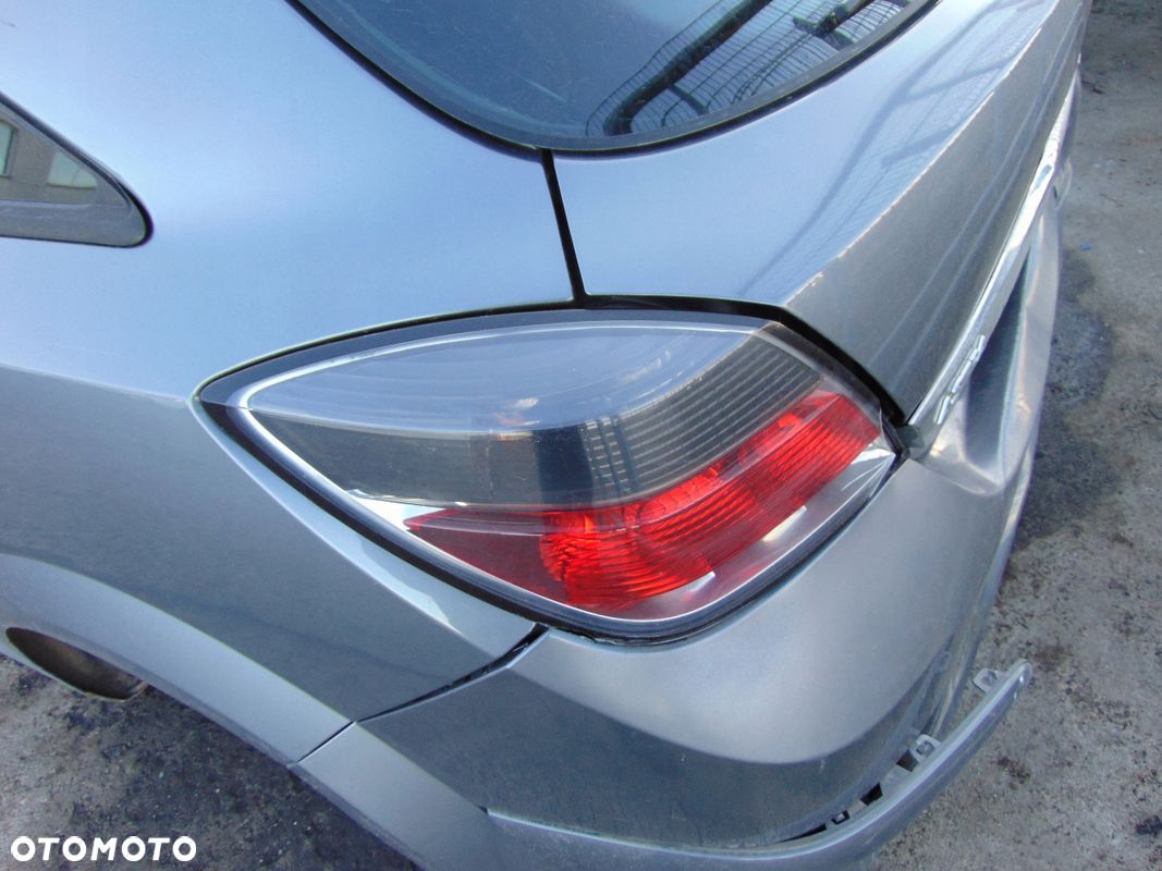 LAMPA LEWA TYŁ TYLNIA CIEMNA EUROPA OPEL ASTRA III H GTC Z155 3D - 1