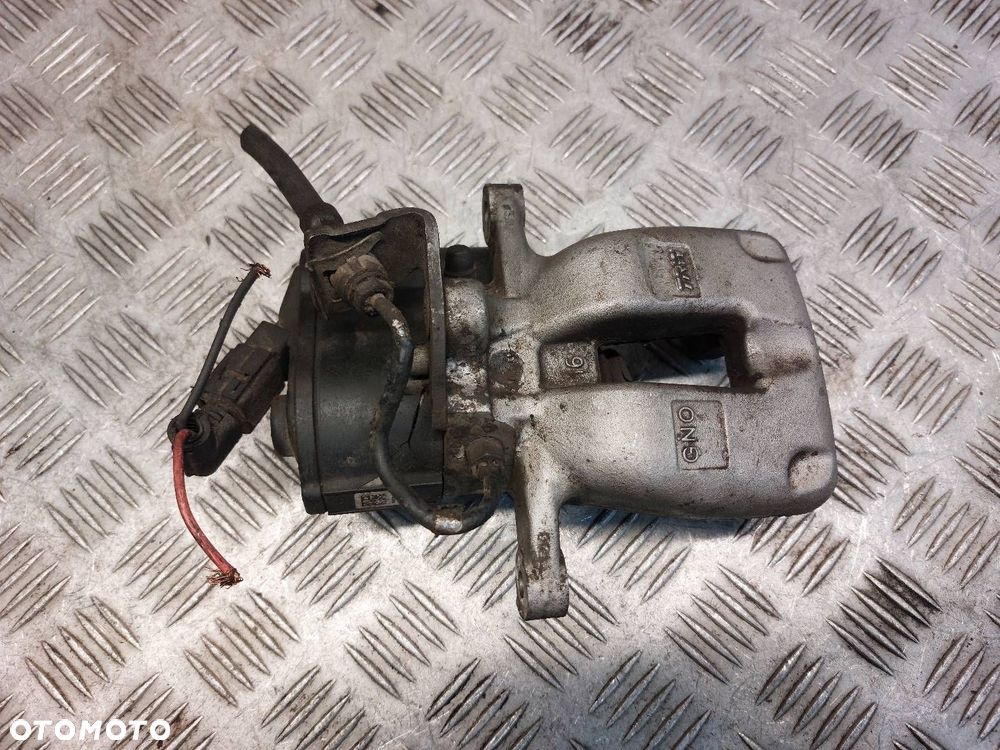 ZACISK HAMULCOWY LEWY TYŁ VOLKSWAGEN PASSAT B6 - 5