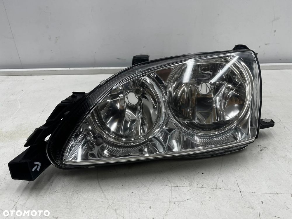 Lampa reflektor Toyota Avensis I T22 Lift 00-03r. NOWA lewa oryginał Europa jasna lewy przód 92101a2 - 1
