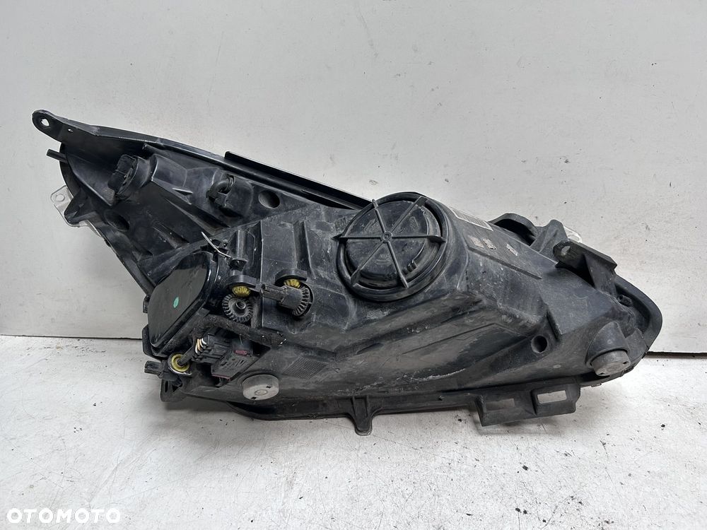 Reflektor lewy Opel Corsa D 13186381 - 3