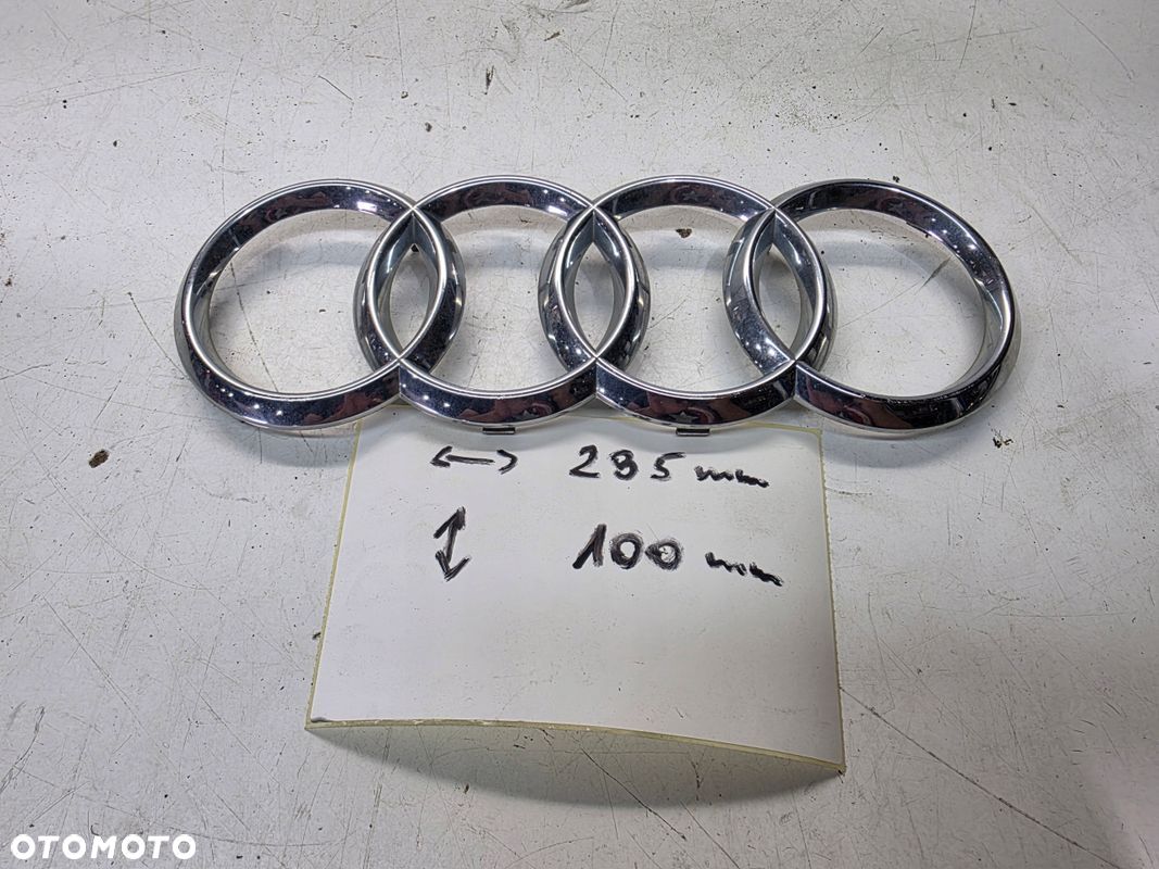 ZNACZEK EMBLEMAT Z ATRAPY PRZÓD GRILLA AUDI Q3 8U A8 4H0853605B 285MMX100MM - 1