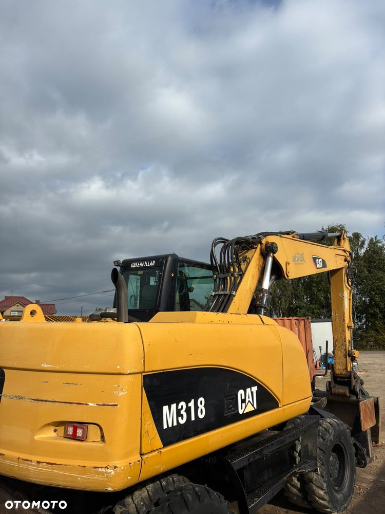 Caterpillar M318C - 6