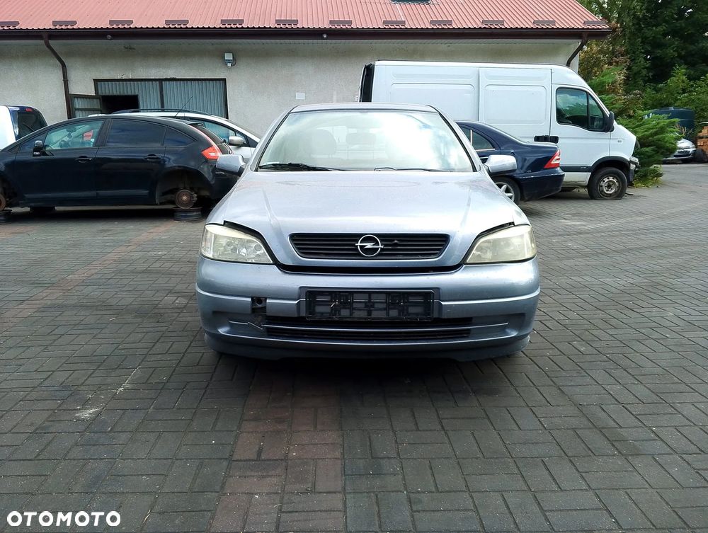 Opel Astra G (04r.) 2.0 HDI 89KM. Silnik Z14XE Skrzynia MG4 lakier 163 / 4AU / GBJ - SILVER LIGHTNING.Cały na części. GWARANCJA !!!  Przód Tył Zestaw Komplet Drzwi Klapa Zderzak Błotnik Maska Grill Atrapa Szyba Pas Lampa Lusterko Boczki Fotel Kanapa Kokpit Deska Rozdzielcza Przełącznik Włącznik Sterownik Przewody Wiązka Instalacja Moduł Komputer Czujnik Listwa Pompa Alternator Wtryski Głowica Rozrusznik Kompresor Sprzęgło Dwumas Silnik Skrzynia ABS Klimatyzacji Paliwa Wspomagania Kolektor Turbina Przepustnica Zawór Chłodnica Koło Hak Belka Sanki Zawieszenie Mcpherson Półoś Amortyzator Wydech Tłumik Zacisk Most - 2