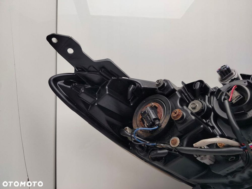 mazda 2 de 2011r reflektor lampa lewy przód lewa przednia soczewka - 9