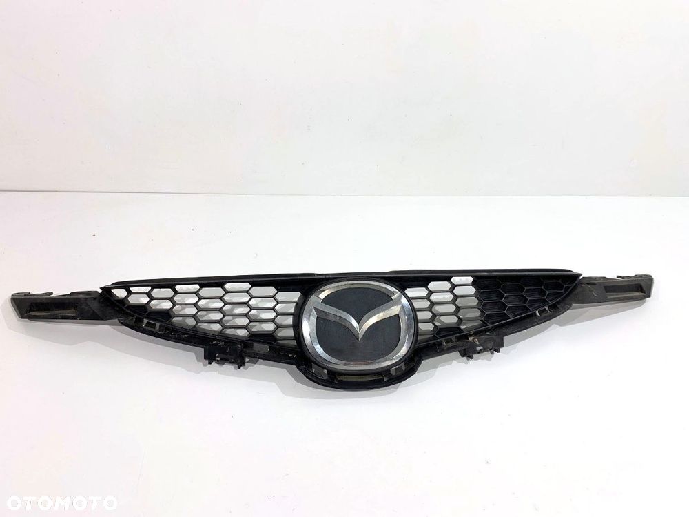 ATRAPA GRILL  MAZDA 2 (DE_, DH_) 2007 - 2015 1.3 (DE3FS) 63 kW [86 KM] benzyna 2007 - 2015 D65150711 - 1