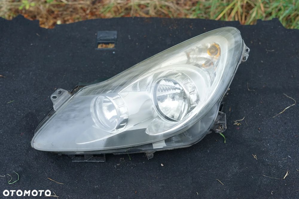 Lampa przód przednia lewa Opel Corsa D 13217455 Anglik