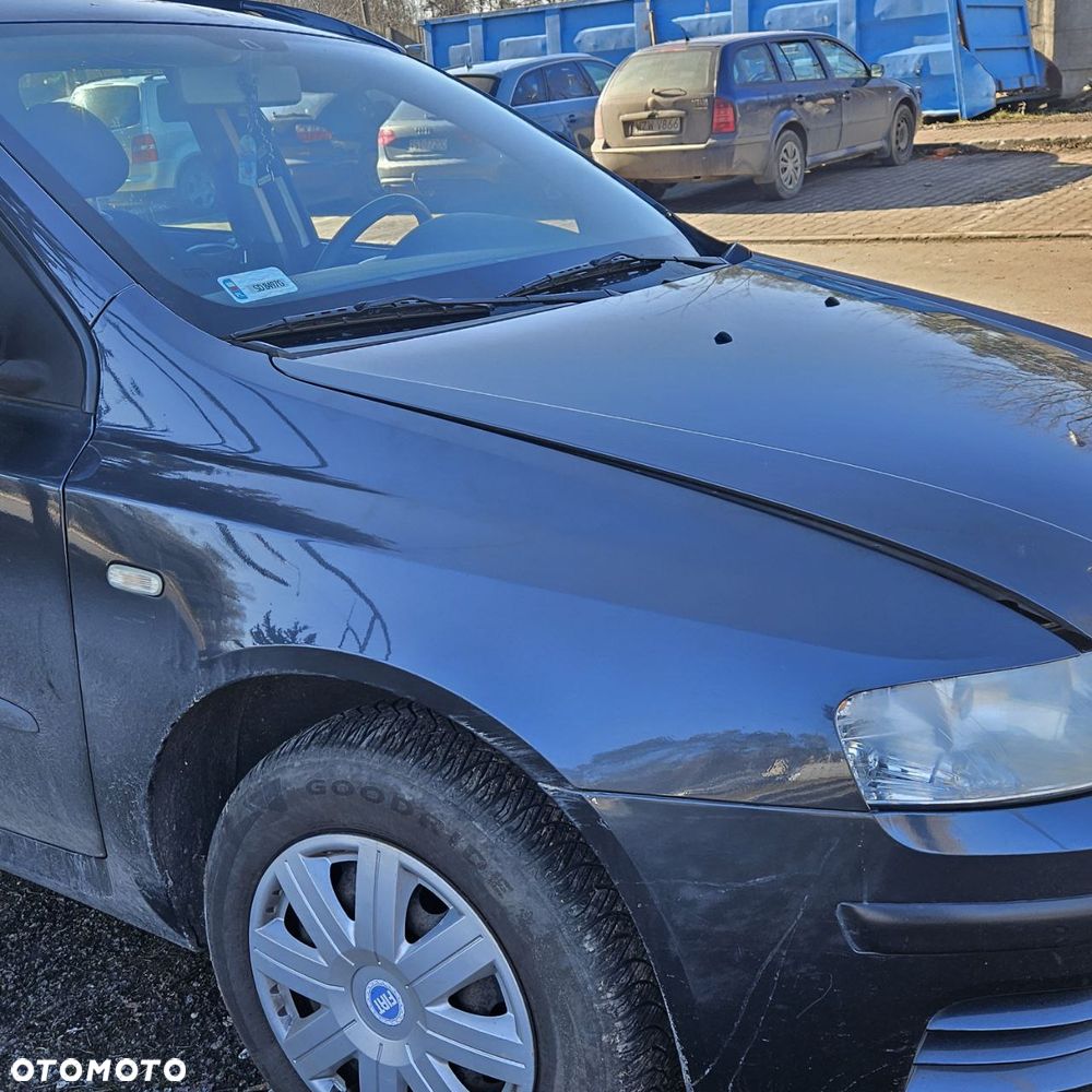 Fiat Stilo 1,6 B 76 kW / 103 KM (2003 kombi) (kod lak: 675) pojazd na części: maska, zderzak, drzwi, szyby, lusterka, chłodnica ... - 7