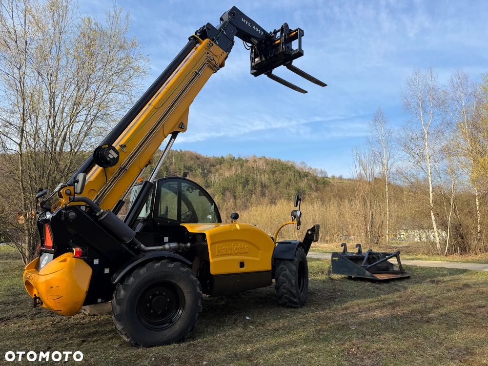 Haulotte HTL 4017 Ładowarka Teleskopowa Dźwig 17m. z Bocianem 22m. Łyżka szufla. widły z Hydraulicznym posuwem! Maszyna z Komuny Norweskiej! Jak Nowa z Salonu. DEKRA aktualna na cały osprzęt! Kamera + szybkozłącze! Bocian 5m. Szybka wolna jazda! Pełna Dokumentacja Serwisowa! Opony zero zużycia! Zero luzów i wycieków! Stabilizatory 2ośie. Wielka Okazja 3430 mtg! Webasto. Gniazdo 220v. Bogata Wersja Norweska - 38