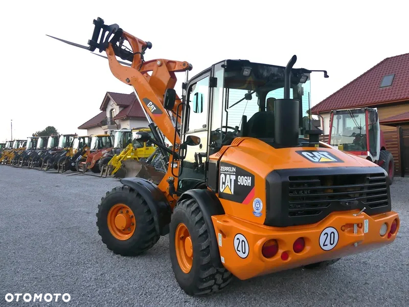 Caterpillar CAT 906H / Z Niemiec / 6424mtg / - 33