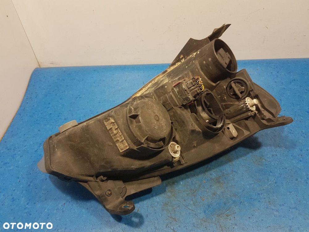 OPEL CORSA C REFLEKTOR LEWY - 12