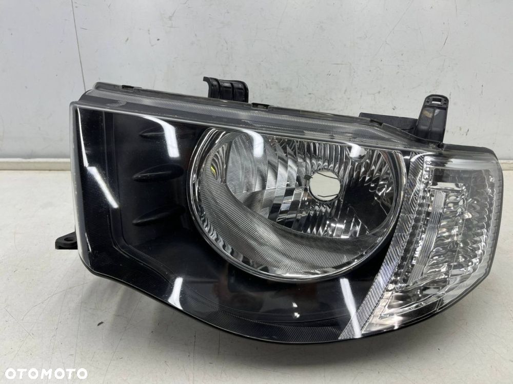 Lampa reflektor Mitsubishi L200 KA KB 05-10r. LEWA przednia H4 oryginalna lewy przód EU 8301b461 - 1