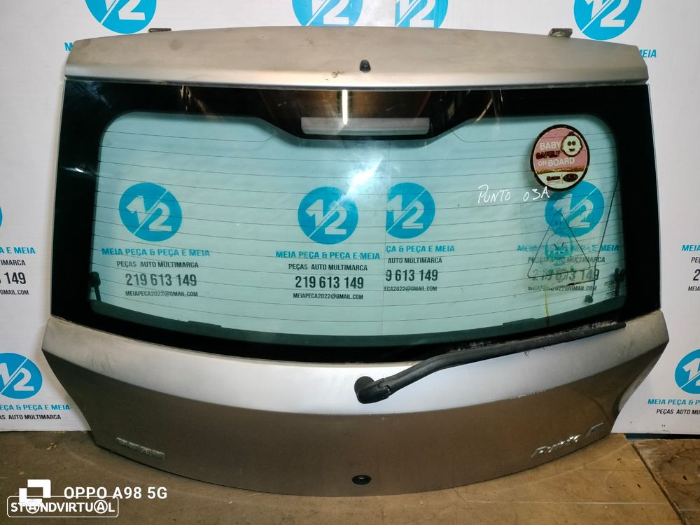 Tampa da Mala Fiat Punto de 2003 - 2