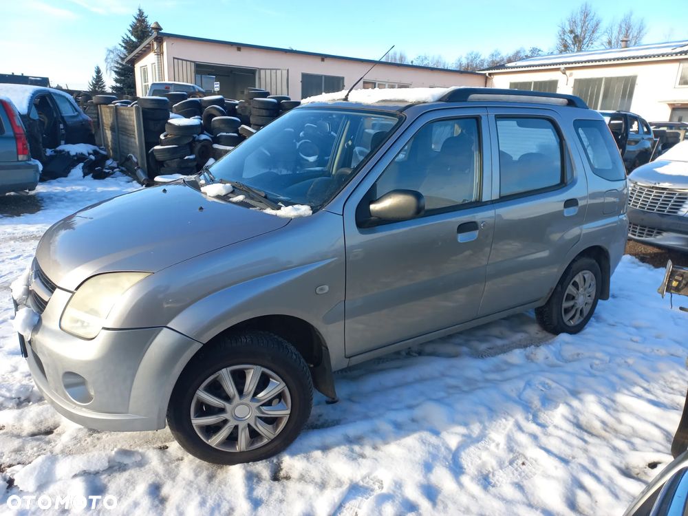 Suzuki Ignis 1.3 DDIS 05r ZU1 blotnik przedni lewy prawy