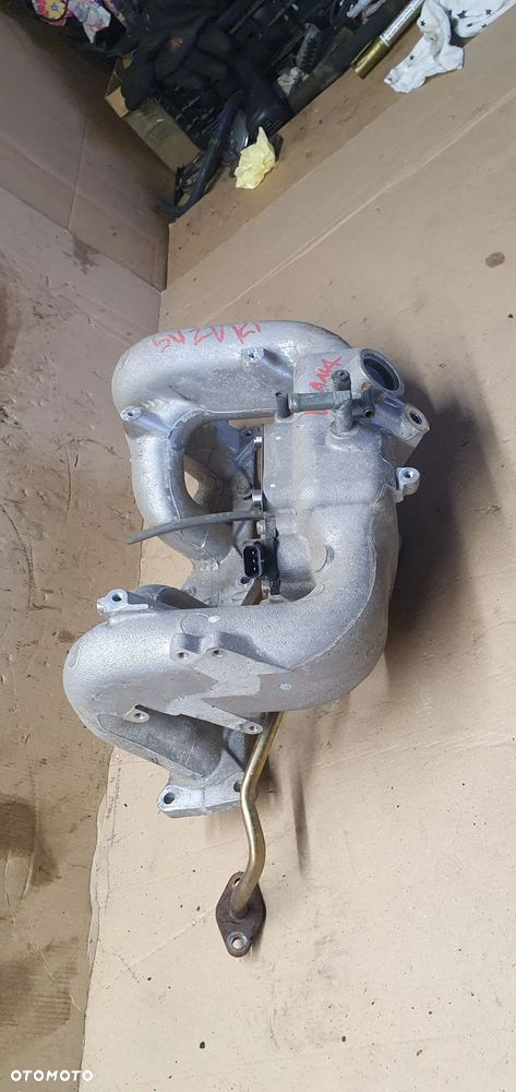 Kolektor ssący Suzuki Liana 1.6 16V E1T26571A - 3