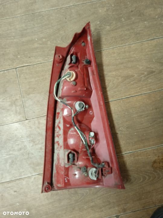 LAMPA TYLNA LEWA MAZDA PREMACY 01-06 ORYGINAŁ - 2