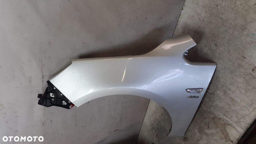 * BŁOTNIK LEWY OPEL ASTRA J IV do malowania Z176 SREBRNY - 2
