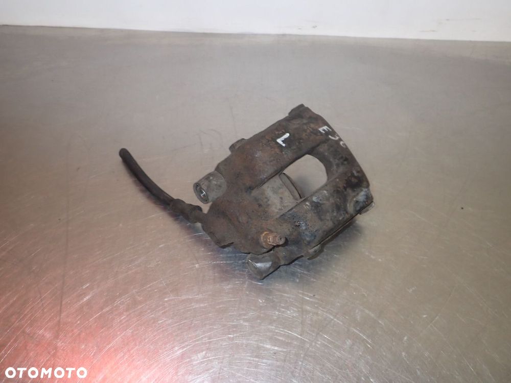 ZACISK HAMULCA LEWY TYŁ BMW E36 - 1
