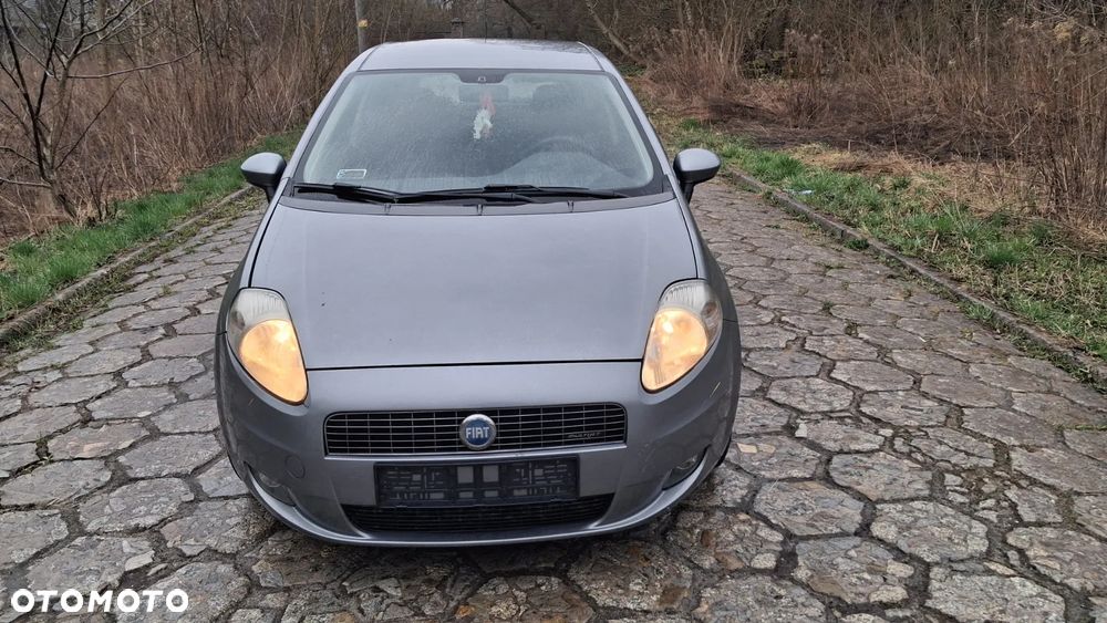 Na części Fiat Grande Punto (199) silnik 1.3 MJTD 16V 90 KM 199A3000 MultiJet lakier 595/A skrzynia maska drzwi klapa szyba fotel kanapa lusterko lampa deska GWARANCJA !!! Przód Tył Zestaw Komplet Drzwi Klapa Zderzak Błotnik Maska Grill Atrapa Szyba Pas Lampa Lusterko Boczki Fotel Kanapa Kokpit Deska Rozdzielcza Przełącznik Włącznik Sterownik Przewody Wiązka Instalacja Moduł Komputer Czujnik Listwa Pompa Alternator Wtryski Głowica Rozrusznik Kompresor Sprzęgło Dwumas Silnik  Skrzynia ABS Klimatyzacji Paliwa Wspomagania Kolektor Turbina Przepustnica Zawór Chłodnica Koło Hak Belka Sanki Zawieszenie Mcpherson Półoś Amortyzator Wydech Tłumik Zacisk Most - 8