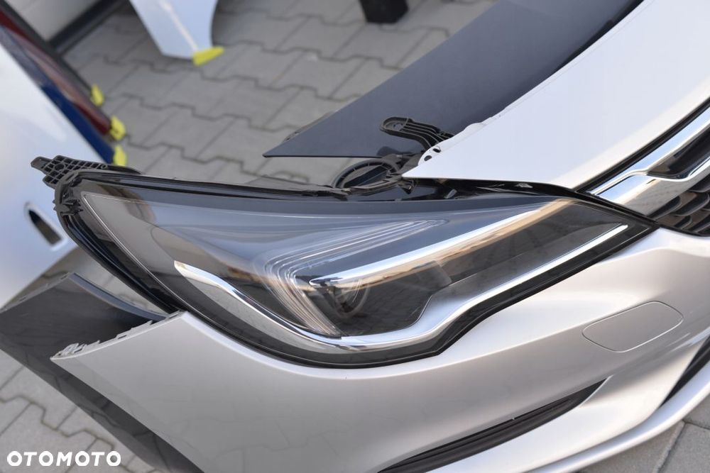 MASKA BŁOTNIK ZDERZAK LAMPA PAS OPEL ASTRA 5 K V - 14