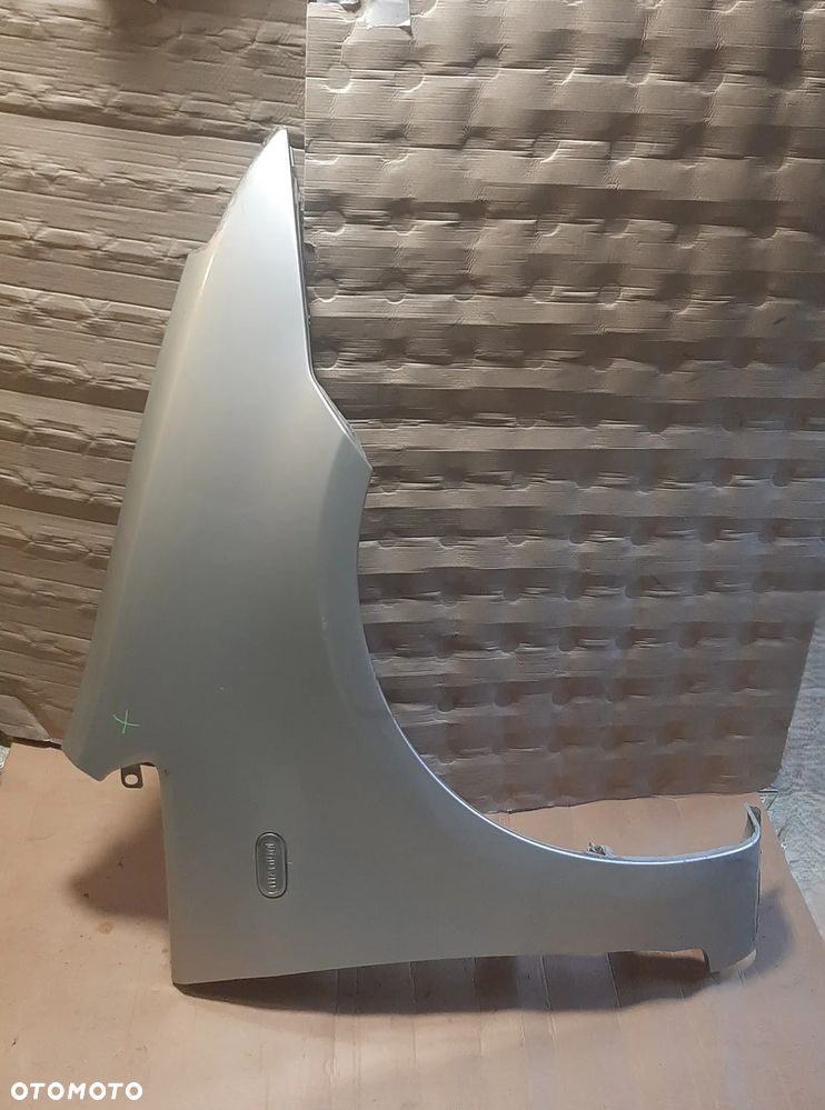 Błotnik  FORD C -MAX 06R prawy  OE - 1