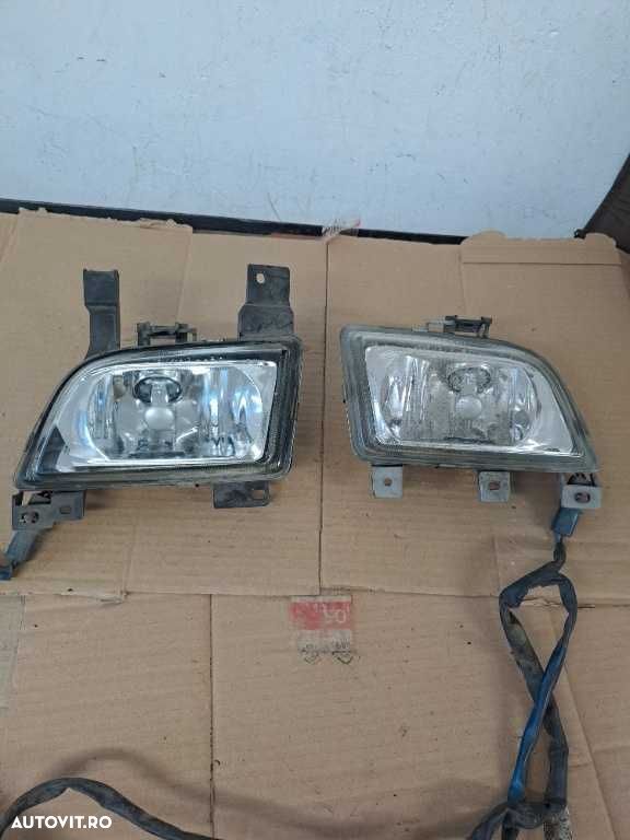 Proiector stanga dreapta Mazda 323 - 1