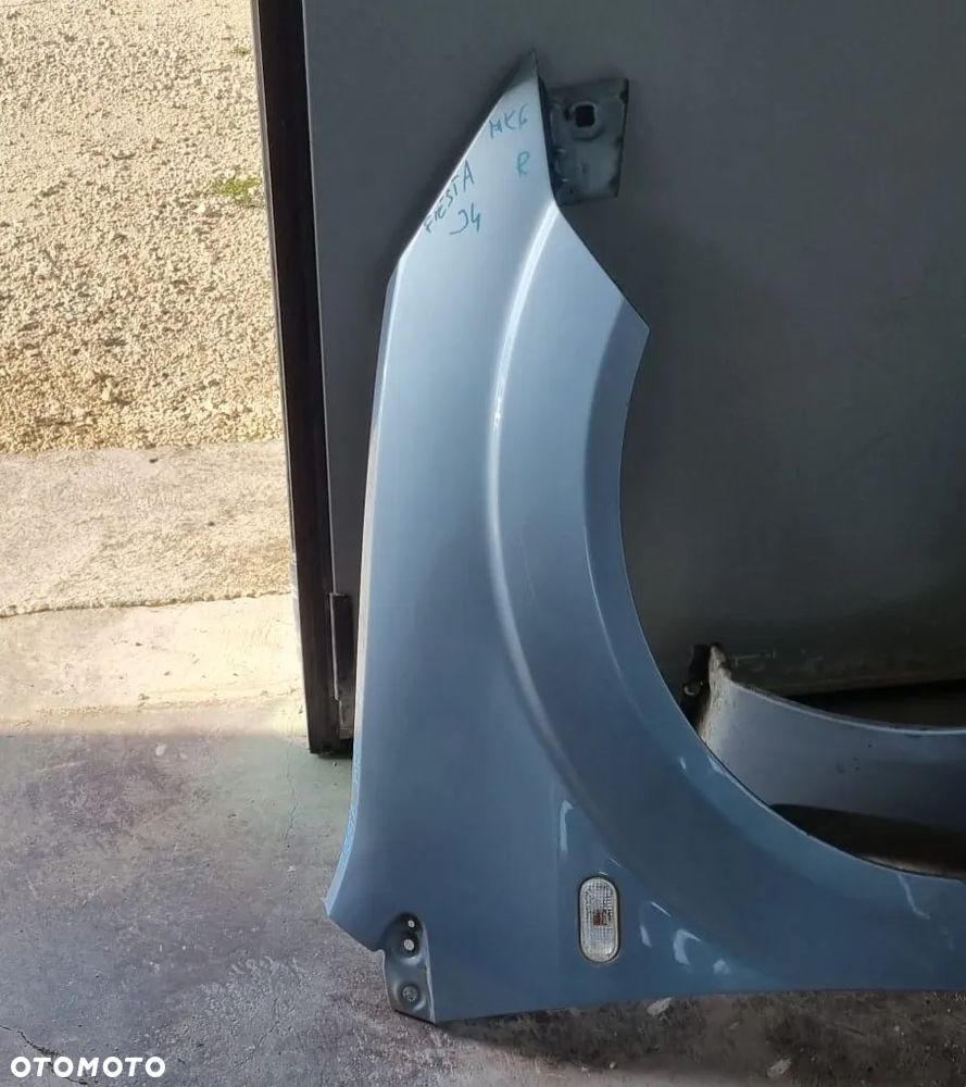 Błotnik Ford Fiesta MK6 J4 prawy OE - 1