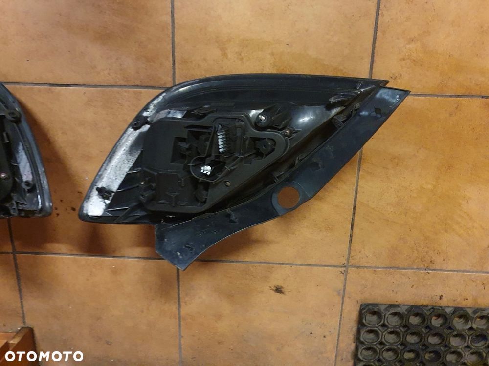 LAMPA L/P TYŁ OPEL ASTRA H III H/B 5 DRZWI - 7