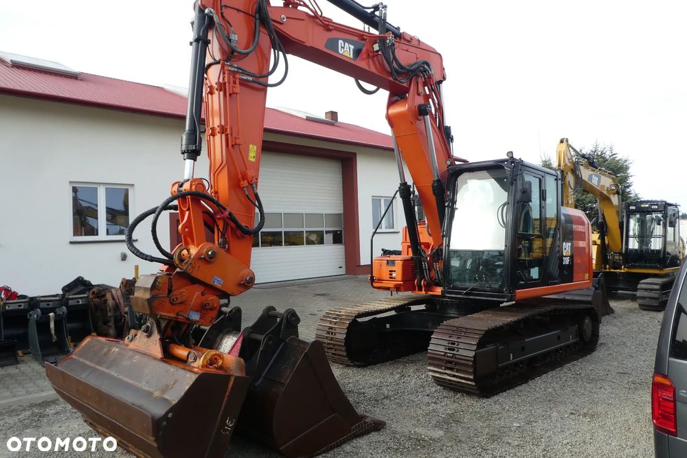 Caterpillar M 318F Z NIEMIEC TRZY ŁYŻKI - 36