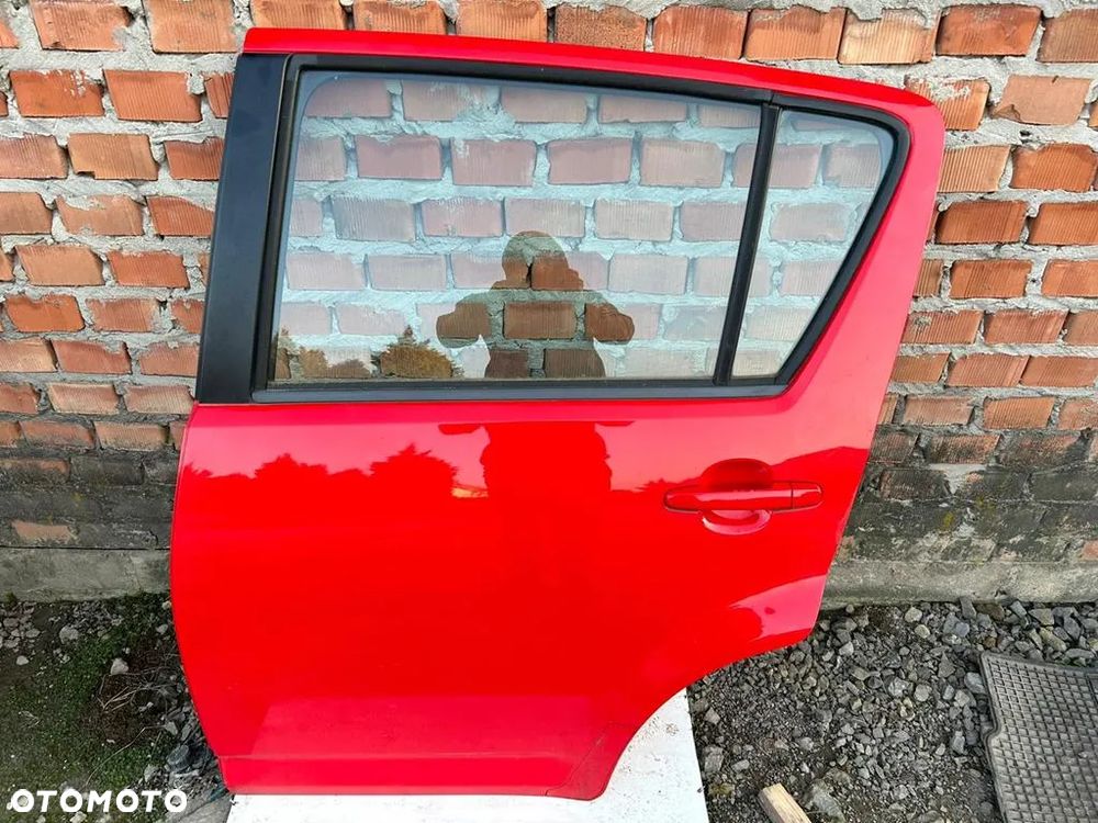 Drzwi lewe tył tylna Daihatsu Sirion II Justy IV bez malowania - 1