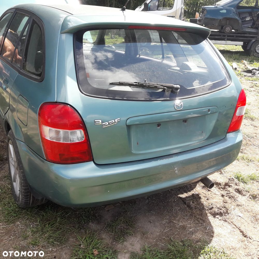 Mazda 323 323f 323  BJ 98-03  Maska lampa zderzak atrapa w kolor 18J - 16