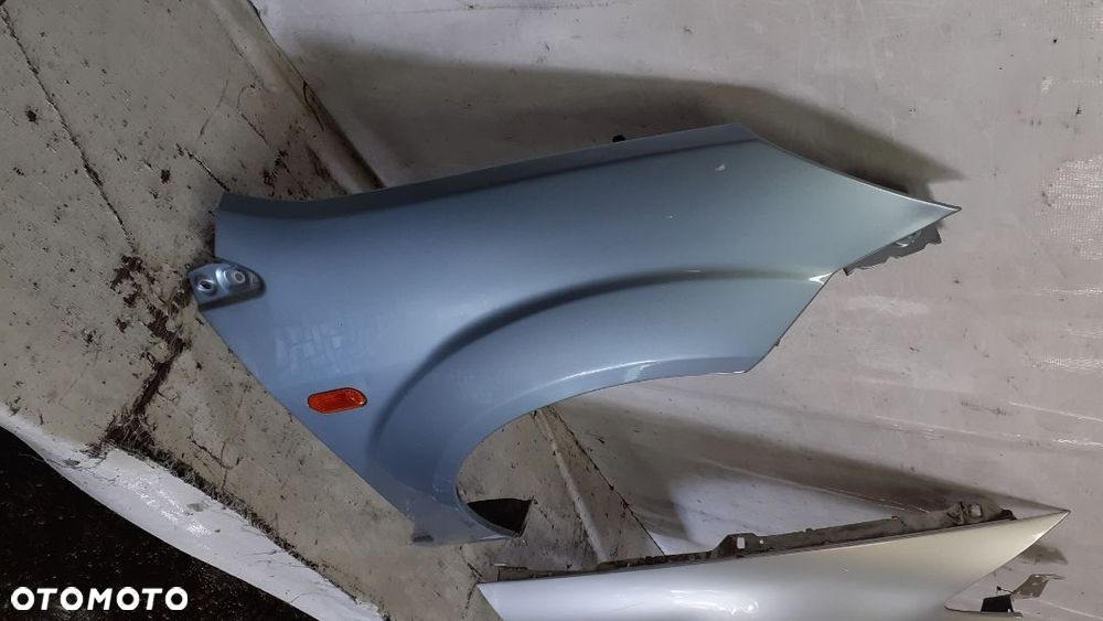 * FORD FIESTA MK.6 VI BŁOTNIK PRZEDNI PRAWY J4 - 2