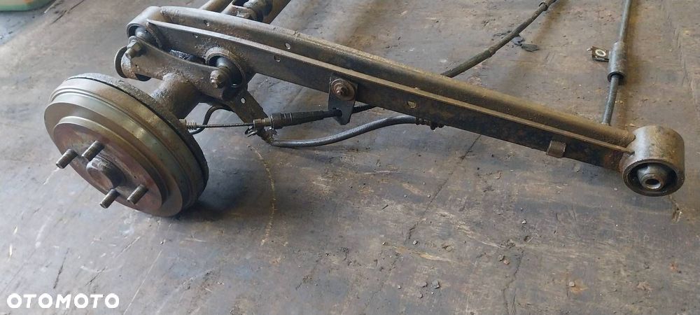 BELKA OŚ ZAWIESZENIA TYŁ BĘBNY BEZ ABS SUZUKI IGNIS I - 3